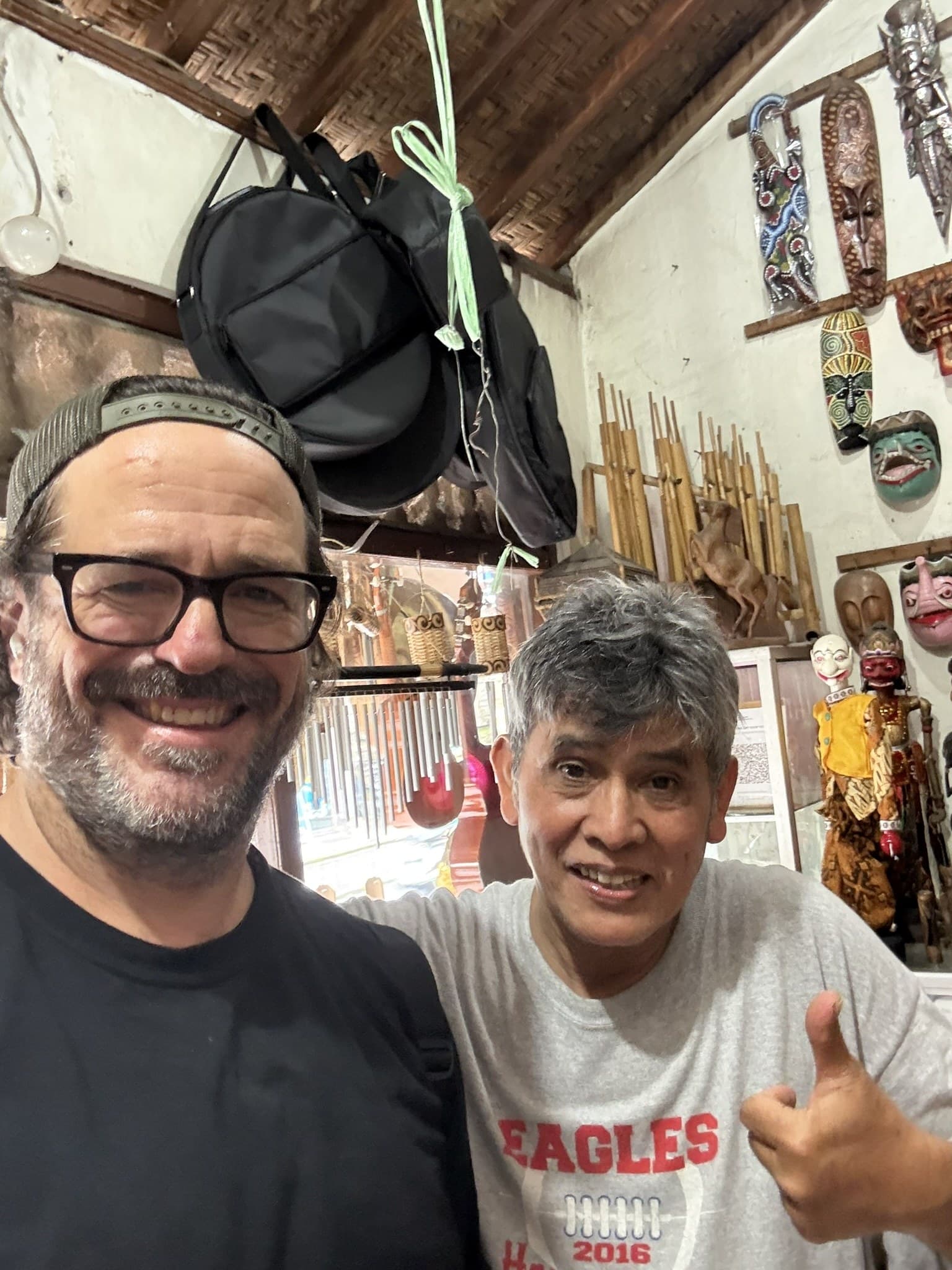 Dustin with the owner of an instrument maker's shop in Bali