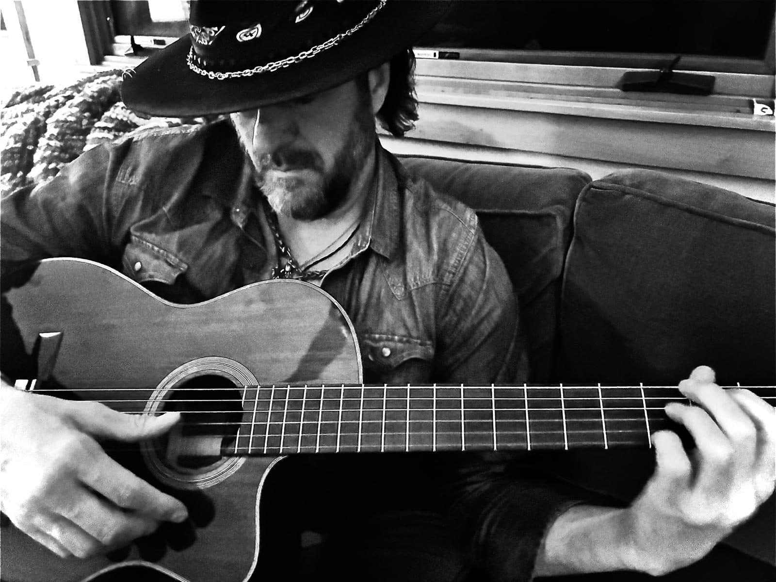 Dustin Wells with guitar