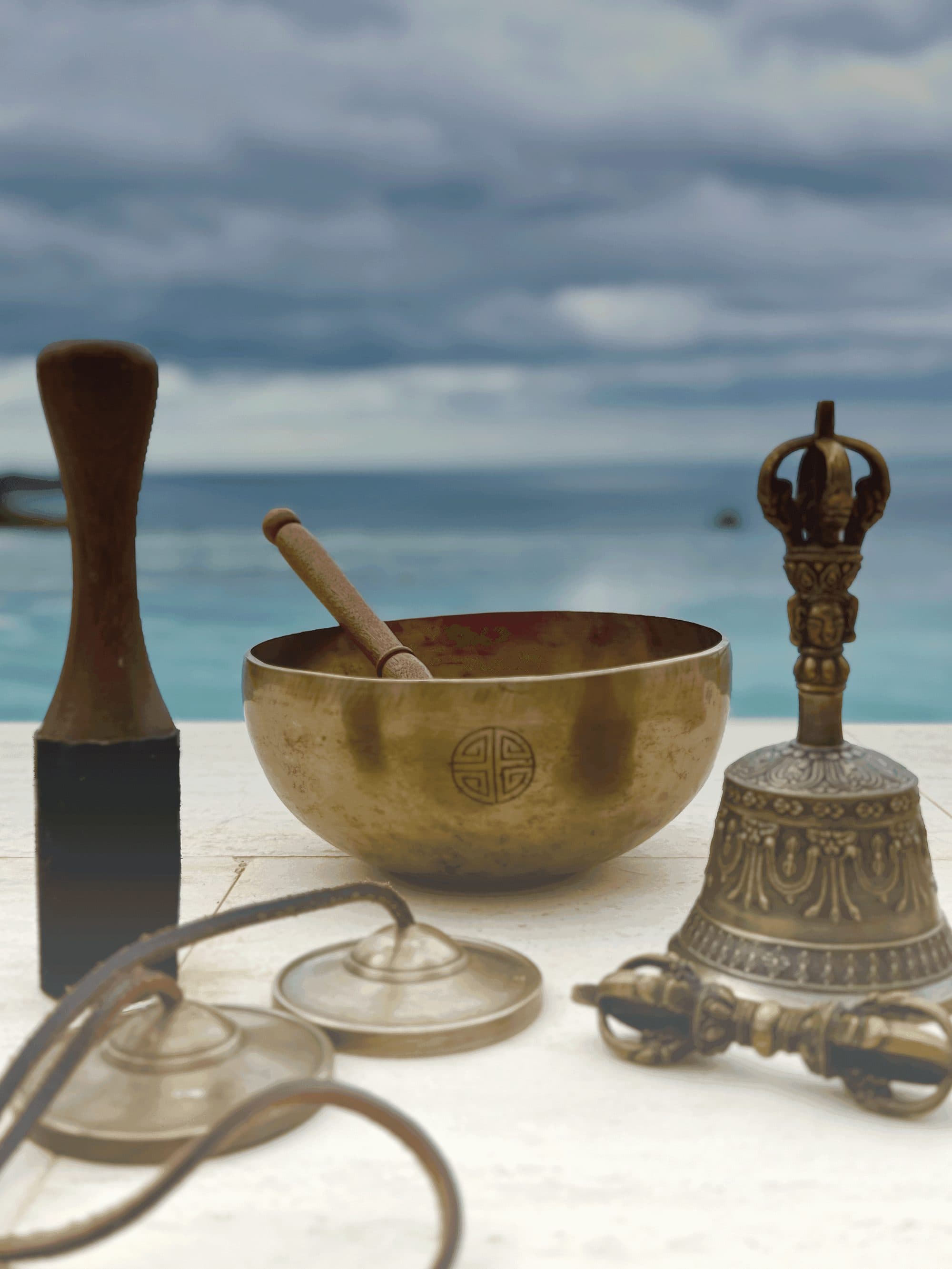 Ceremony instruments beside still water