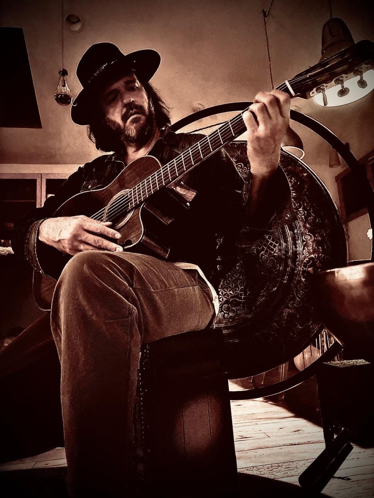 Portrait with guitar, hat